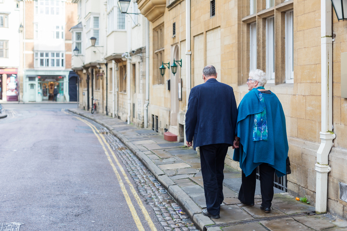 Active Senior Couple Walking on the Streets of Oxford, UK